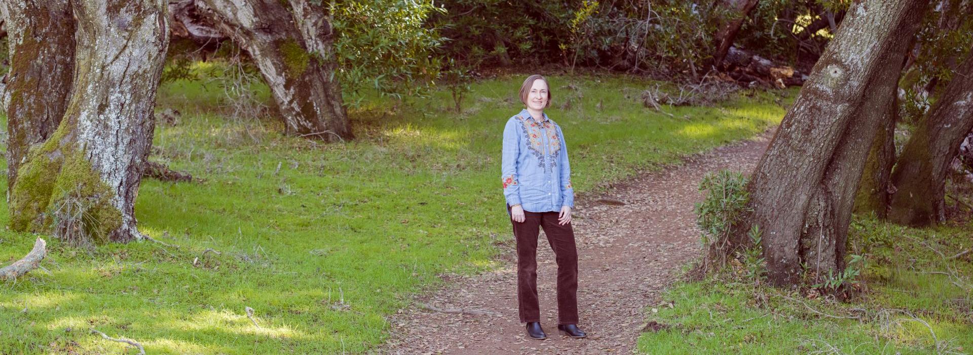 Dorota Umeno on a path in the woods | Big Mamabear